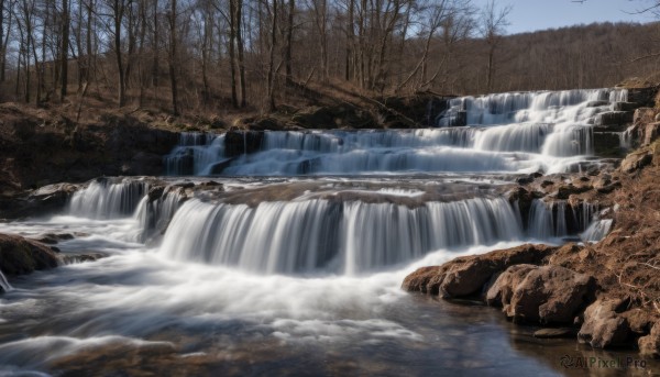 A glimpse of a waterfall in a lush snowy day