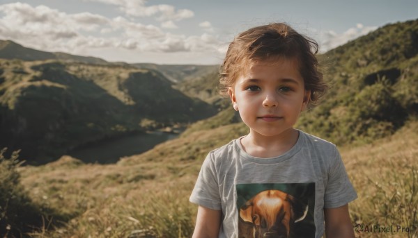 1girl,solo,looking at viewer,smile,short hair,brown hair,shirt,brown eyes,closed mouth,white shirt,upper body,short sleeves,outdoors,sky,day,cloud,blurry,blue sky,lips,blurry background,cloudy sky,wind,t-shirt,child,nature,scenery,mountain,realistic,female child,field,print shirt,blue eyes,1boy,male focus,grass,male child