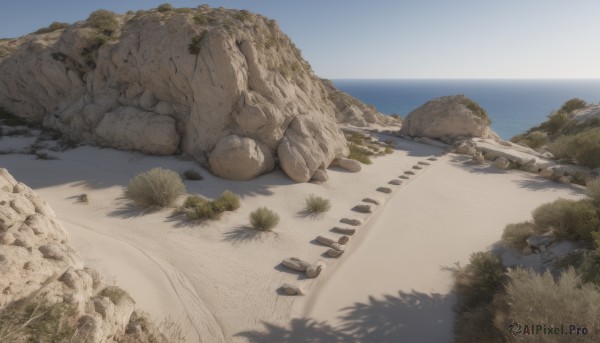 outdoors,sky,day,water,tree,blue sky,no humans,shadow,ocean,beach,grass,scenery,rock,sand,horizon,landscape,shore,desert,plant