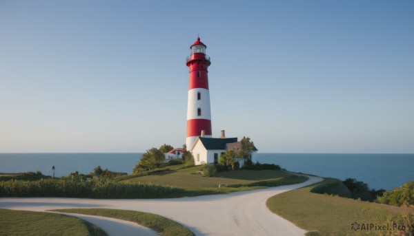 outdoors,sky,day,water,tree,blue sky,no humans,ocean,grass,building,nature,scenery,horizon,road,bush,lamppost,river,castle,tower,landscape,path,beach,sand,shore,lighthouse