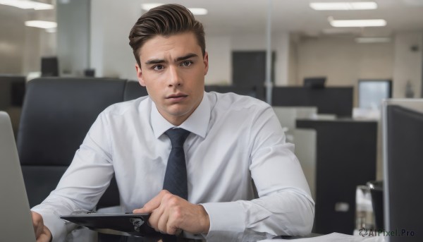 solo,looking at viewer,short hair,brown hair,shirt,black hair,long sleeves,1boy,holding,brown eyes,sitting,closed mouth,white shirt,upper body,male focus,necktie,collared shirt,indoors,blurry,black eyes,blurry background,facial hair,black necktie,realistic,computer,laptop,tablet pc,office,lips,dress shirt,depth of field,chair,stubble,photo background,salaryman