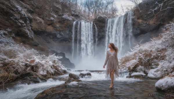 1girl, solo, long hair, brown hair, dress, outdoors, barefoot, water, from behind, tree, nature, scenery, snow, rock, winter, bare tree, waterfall