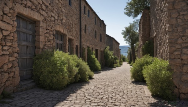 outdoors,sky,day,water,tree,blue sky,no humans,window,shadow,grass,plant,building,scenery,door,road,bush,wall,house,brick wall,path,cloud,street,stone wall