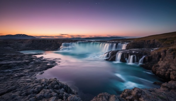 A waterfall captured beautifully in a inviting sunset outdoors