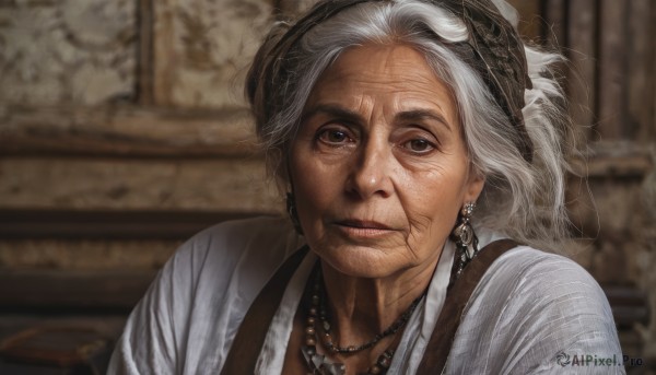 1girl,solo,looking at viewer,shirt,brown eyes,jewelry,closed mouth,white shirt,upper body,white hair,grey hair,earrings,indoors,necklace,blurry,lips,blurry background,suspenders,portrait,freckles,realistic,head scarf,old,pearl necklace,old woman,wrinkled skin,smile,hair bun,depth of field