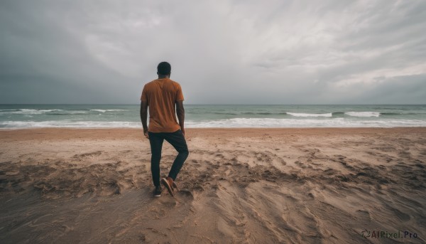 solo,short hair,shirt,black hair,1boy,standing,short sleeves,male focus,outdoors,sky,shoes,pants,cloud,water,from behind,ocean,beach,black pants,cloudy sky,t-shirt,scenery,walking,sand,horizon,facing away,wide shot,orange shirt,waves,shore,grey sky,footprints,day,sneakers