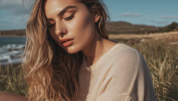 1girl,solo,long hair,blonde hair,brown hair,shirt,jewelry,closed eyes,white shirt,upper body,earrings,outdoors,parted lips,sky,day,necklace,blurry,blue sky,lips,eyelashes,depth of field,blurry background,wavy hair,grass,realistic,nose,cloud,water,ocean,horizon,field