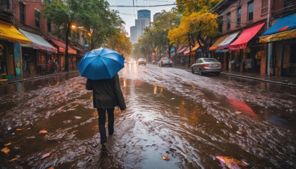 solo, long sleeves, holding, jacket, outdoors, sky, day, pants, from behind, tree, dutch angle, umbrella, ground vehicle, building, scenery, motor vehicle, walking, rain, holding umbrella, city, car, road, autumn leaves, power lines, lamppost, street, crosswalk