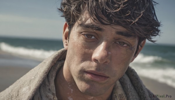 solo,looking at viewer,short hair,bangs,brown hair,black hair,1boy,brown eyes,closed mouth,male focus,outdoors,day,mole,blurry,lips,mole under eye,depth of field,blurry background,ocean,beach,towel,messy hair,portrait,realistic,sand,towel around neck,shirt,sky,collared shirt,water,facial hair,expressionless,sunlight,thick eyebrows,close-up,nose,horizon