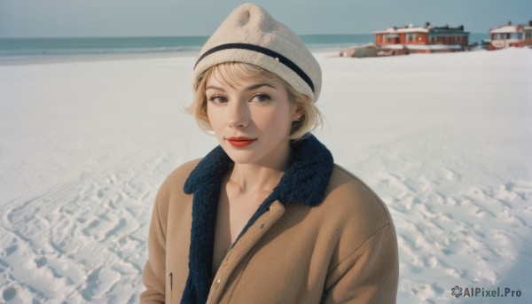 1girl,solo,looking at viewer,smile,short hair,blonde hair,hat,closed mouth,jacket,upper body,outdoors,day,scarf,black eyes,lips,coat,ocean,white headwear,beach,snow,realistic,beanie,winter clothes,red lips,watercraft,blue scarf,brown coat,boat,photo background,bangs,blue eyes,jewelry,earrings,makeup,lipstick,stud earrings,winter