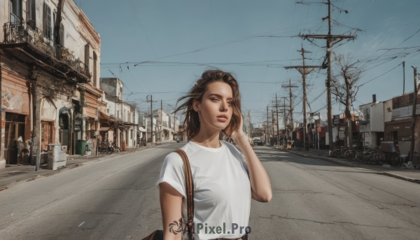 1girl,solo,looking at viewer,short hair,brown hair,shirt,brown eyes,closed mouth,white shirt,upper body,short sleeves,earrings,outdoors,sky,solo focus,day,hand up,medium hair,bag,tree,blue sky,lips,ground vehicle,t-shirt,building,scenery,motor vehicle,hand in own hair,handbag,shoulder bag,city,realistic,car,road,power lines,lamppost,street,utility pole,crosswalk,real world location,parted lips,wind,bicycle,vanishing point