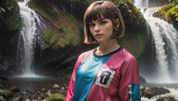 1girl,solo,breasts,looking at viewer,short hair,bangs,brown hair,shirt,long sleeves,brown eyes,upper body,small breasts,outdoors,parted lips,day,blunt bangs,water,blurry,tree,lips,wet,blurry background,bob cut,blue shirt,nature,realistic,nose,print shirt,river,waterfall,blue eyes,jewelry,earrings,leaf,sunlight,freckles,rock,sportswear,soccer uniform