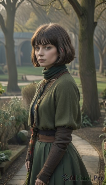 1girl,solo,looking at viewer,short hair,bangs,skirt,brown hair,black hair,long sleeves,dress,brown eyes,jewelry,closed mouth,standing,outdoors,day,belt,necklace,blurry,from side,tree,lips,capelet,depth of field,blurry background,bob cut,pendant,freckles,green dress,realistic,nose,layered sleeves,short over long sleeves,blue eyes,scarf,grass,plant,bush