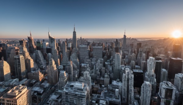 outdoors,sky,day,cloud,water,blue sky,no humans,ocean,sunlight,building,scenery,sunset,city,sun,horizon,cityscape,skyscraper,tower,city lights,sunrise,skyline,lens flare,real world location