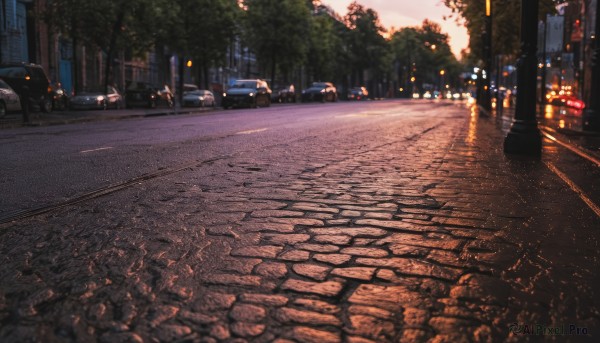 outdoors,sky,tree,no humans,night,ground vehicle,building,scenery,motor vehicle,sunset,city,car,road,lamppost,street,evening,pavement,real world location,sidewalk,blurry,shadow,nature,forest,cityscape,vanishing point