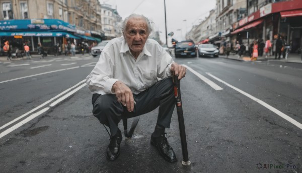 solo,looking at viewer,shirt,long sleeves,1boy,holding,sitting,closed mouth,white shirt,weapon,white hair,grey hair,male focus,outdoors,shoes,solo focus,day,collared shirt,pants,sword,black footwear,blurry,facial hair,black pants,squatting,ring,katana,ground vehicle,building,sheath,sneakers,motor vehicle,beard,sheathed,city,realistic,car,road,old,old man,street,cane,photo background,people,crosswalk,wrinkled skin,short hair,full body,black eyes,blurry background,cigarette,sign,mustache,hand on own knee,old woman