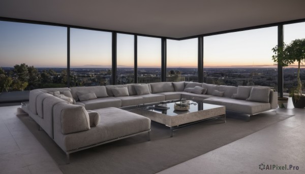 sky,cloud,indoors,water,tree,cup,pillow,no humans,window,ocean,chair,table,plant,building,scenery,couch,city,horizon,potted plant,cityscape,skyline,sunset,skyscraper