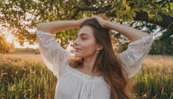 1girl,solo,long hair,smile,brown hair,shirt,brown eyes,jewelry,white shirt,upper body,flower,earrings,outdoors,parted lips,teeth,day,blurry,arms up,tree,lips,looking to the side,depth of field,blurry background,looking away,sunlight,grass,realistic,hands on own head,blue eyes,dress,white dress,leaf