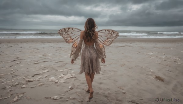 1girl, solo, long hair, brown hair, dress, bare shoulders, outdoors, detached sleeves, wings, sky, barefoot, cloud, dark skin, water, from behind, dark-skinned female, ocean, beach, cloudy sky, walking, backless outfit, sand, fairy, backless dress, waves, butterfly wings, footprints, insect wings, dirty feet