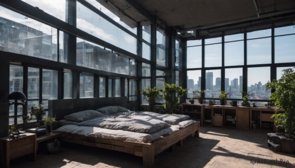 sky,day,cloud,indoors,tree,blue sky,pillow,book,no humans,window,bed,shadow,chair,table,sunlight,cloudy sky,plant,curtains,building,scenery,couch,wooden floor,city,railing,potted plant,lamp,cityscape,skyscraper,flower pot,blinds,skyline,flower,bed sheet,on bed,desk