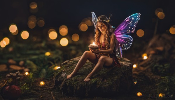 1girl,solo,long hair,breasts,smile,open mouth,brown hair,hair ornament,dress,holding,cleavage,bare shoulders,brown eyes,medium breasts,sitting,closed eyes,outdoors,food,wings,barefoot,blurry,lips,bare legs,night,depth of field,blurry background,nature,minigirl,lantern,fairy wings,candle,fairy,mushroom,bokeh,butterfly wings,fireflies,tiara,realistic,jack-o'-lantern,pumpkin,tree stump