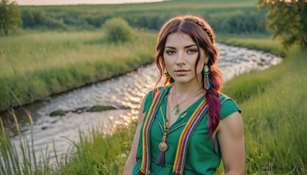 1girl,solo,long hair,looking at viewer,smile,brown hair,shirt,brown eyes,jewelry,upper body,braid,multicolored hair,earrings,outdoors,parted lips,sleeveless,day,water,necklace,blurry,vest,tree,lips,grass,feathers,realistic,green shirt,river,breasts,dress,blurry background,pendant,green dress