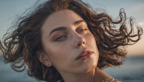 1girl,solo,short hair,blue eyes,brown hair,jewelry,earrings,outdoors,parted lips,day,necklace,mole,blurry,lips,floating hair,blurry background,wind,portrait,freckles,realistic,nose,mole on cheek,long hair,looking at viewer,black hair,lying,one eye closed,teeth,on back,grey eyes,eyelashes,thick eyebrows,close-up