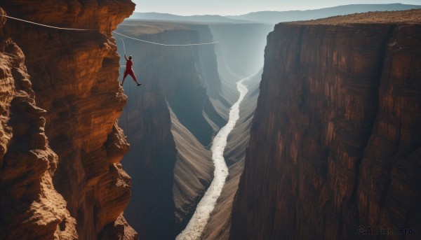 solo,1boy,standing,male focus,outdoors,sky,day,water,from behind,cape,scenery,1other,rock,mountain,ambiguous gender,cliff,cave,1girl,landscape