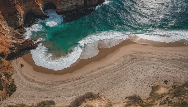 outdoors,water,tree,no humans,ocean,beach,scenery,rock,mountain,sand,waves,shore,day,shadow,footprints