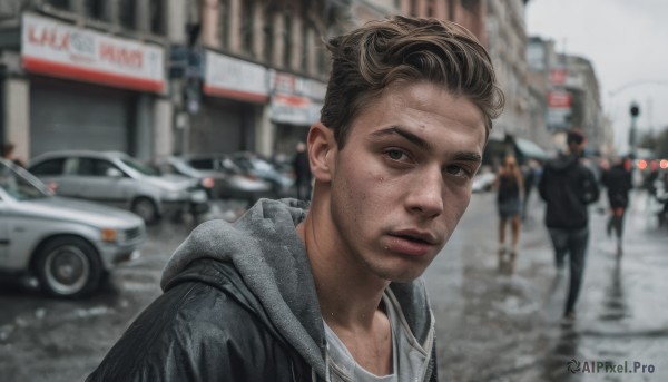 looking at viewer,short hair,brown hair,shirt,black hair,1boy,closed mouth,jacket,white shirt,upper body,male focus,outdoors,multiple boys,solo focus,hood,blurry,black eyes,lips,black jacket,hoodie,depth of field,blurry background,facial hair,hood down,ground vehicle,motor vehicle,realistic,car,road,street,photo background,grey hoodie,day,portrait,hooded jacket,city,grey jacket,stubble,people