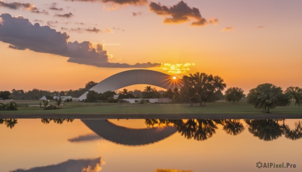 A landscape surrounded by a lush sunset outdoors