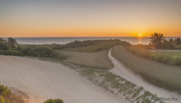 A landscape surrounded by a serene sunset outdoors