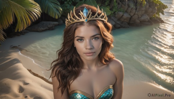 1girl,solo,long hair,breasts,looking at viewer,smile,brown hair,cleavage,bare shoulders,brown eyes,medium breasts,closed mouth,collarbone,swimsuit,upper body,outdoors,day,dark skin,water,dark-skinned female,tree,lips,strapless,ocean,beach,sunlight,tiara,crown,plant,rock,realistic,nose,sand,palm tree,shore,bikini