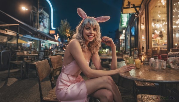 1girl,solo,long hair,looking at viewer,smile,open mouth,bangs,blonde hair,dress,animal ears,bare shoulders,brown eyes,sitting,teeth,sleeveless,indoors,medium hair,white dress,rabbit ears,blurry,cup,lips,bare arms,makeup,night,sleeveless dress,blurry background,fake animal ears,wavy hair,chair,short dress,table,crossed legs,bottle,pink dress,alcohol,drinking glass,city,realistic,stool,city lights,restaurant,cafe,breasts,holding,white hair,dark skin,grin,dark-skinned female,window,tattoo,leaning forward,lipstick,holding cup,photo background,bar (place),viera,neon lights,bar stool