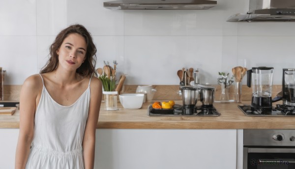 1girl,solo,long hair,looking at viewer,smile,brown hair,dress,bare shoulders,brown eyes,collarbone,upper body,food,sleeveless,indoors,white dress,mole,cup,lips,fruit,sleeveless dress,table,knife,plant,plate,freckles,realistic,orange (fruit),kitchen,frying pan,sink,stove,kitchen knife,cutting board,flower,mole under mouth,bowl