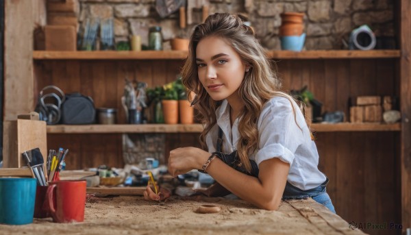 1girl,solo,long hair,looking at viewer,smile,brown hair,shirt,brown eyes,jewelry,sitting,closed mouth,white shirt,upper body,short sleeves,earrings,indoors,bag,blurry,apron,bracelet,lips,blurry background,wavy hair,table,denim,watch,realistic,nose,wristwatch,overalls,paintbrush,pencil,shelf,counter,painting (action),blue eyes,blonde hair,necklace,cup