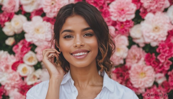 1girl,solo,long hair,looking at viewer,smile,open mouth,brown hair,shirt,brown eyes,collarbone,white shirt,upper body,flower,teeth,collared shirt,hand up,medium hair,grin,blurry,lips,fingernails,depth of field,blurry background,thick eyebrows,portrait,pink flower,realistic,nose,black hair,:d,dark skin,dark-skinned female,floral background