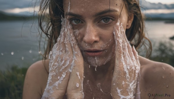 1girl,solo,long hair,looking at viewer,brown hair,bare shoulders,brown eyes,closed mouth,upper body,nude,outdoors,parted lips,day,dark skin,medium hair,water,blurry,lips,wet,hands up,depth of field,blurry background,portrait,freckles,realistic,nose,hands on own face,wet hair,straight-on,hands on own cheeks,black hair,gloves,dress,collarbone,beach,close-up,lace gloves