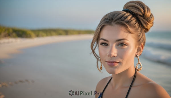 1girl,solo,looking at viewer,smile,short hair,brown hair,bare shoulders,brown eyes,jewelry,closed mouth,collarbone,swimsuit,bikini,earrings,outdoors,day,water,hair bun,blurry,lips,depth of field,blurry background,ocean,beach,single hair bun,portrait,blue bikini,hoop earrings,realistic,sand,upper body,sky,necklace,blue sky,freckles,nose