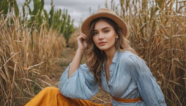 1girl,solo,long hair,breasts,looking at viewer,smile,skirt,brown hair,shirt,long sleeves,hat,brown eyes,jewelry,sitting,white shirt,earrings,outdoors,parted lips,day,striped,hand up,nail polish,blurry,lips,blurry background,blue shirt,freckles,long skirt,realistic,nose,brown headwear,straw hat,field,blue eyes,sky,wide sleeves,necklace,sash,makeup,vertical stripes,hand on headwear,adjusting headwear