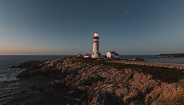 outdoors,sky,water,no humans,night,ocean,grass,star (sky),night sky,scenery,starry sky,rock,horizon,tower,landscape,cliff,lighthouse,beach,building,sand,shore,real world location