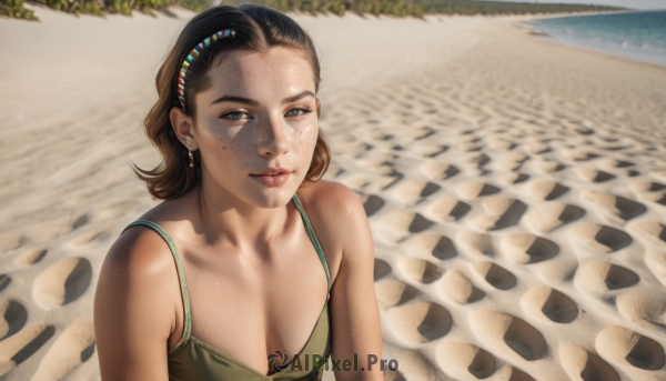 1girl,solo,breasts,looking at viewer,short hair,blue eyes,brown hair,black hair,cleavage,bare shoulders,jewelry,medium breasts,collarbone,upper body,hairband,earrings,small breasts,outdoors,day,medium hair,water,lips,beach,freckles,realistic,nose,sand,body freckles,dress,brown eyes,closed mouth,ocean,forehead,spaghetti strap