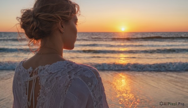 1girl, solo, brown hair, jewelry, upper body, earrings, outdoors, sky, water, necklace, hair bun, from behind, blurry, blurry background, ocean, beach, single hair bun, sunset, sun, horizon