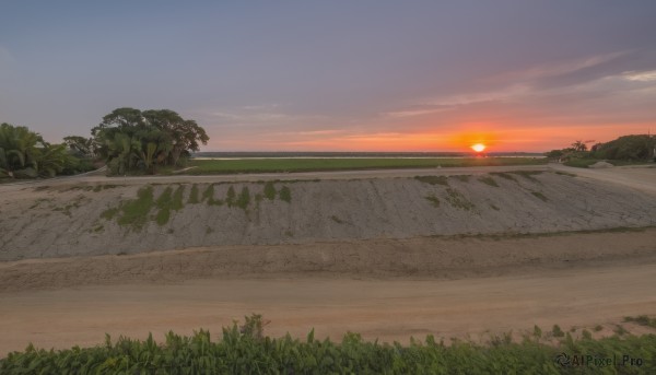 A landscape showcased in a tranquil sunset outdoors