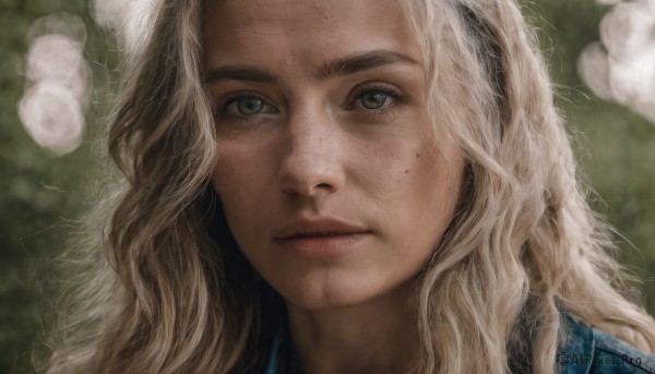 1girl,solo,long hair,looking at viewer,blue eyes,blonde hair,closed mouth,blurry,lips,grey eyes,eyelashes,blurry background,wavy hair,expressionless,portrait,close-up,freckles,realistic,nose,green eyes,flower