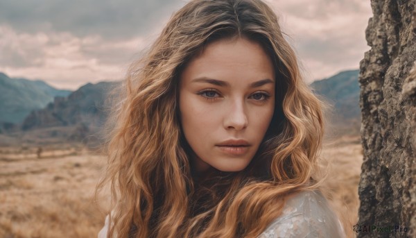 1girl,solo,long hair,looking at viewer,blue eyes,blonde hair,brown hair,closed mouth,upper body,outdoors,sky,day,cloud,blurry,lips,grey eyes,eyelashes,blurry background,wavy hair,cloudy sky,portrait,forehead,freckles,curly hair,mountain,realistic,nose,parted lips,depth of field,expressionless