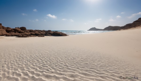 outdoors,sky,day,cloud,water,blue sky,no humans,ocean,beach,scenery,rock,sand,sun,horizon,waves,shore