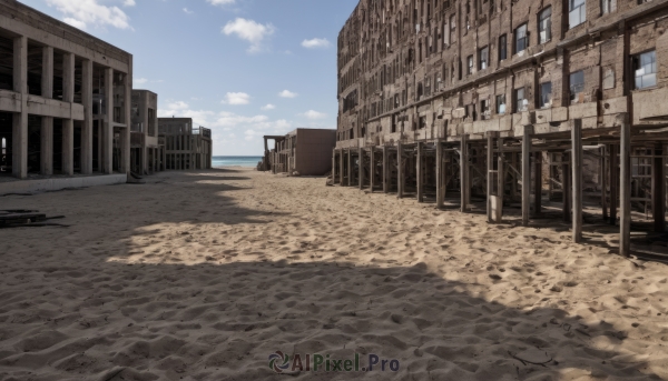 outdoors,sky,day,cloud,water,blue sky,no humans,window,shadow,ocean,cloudy sky,building,scenery,city,fence,railing,road,ruins,street,sign,sand,horizon,real world location