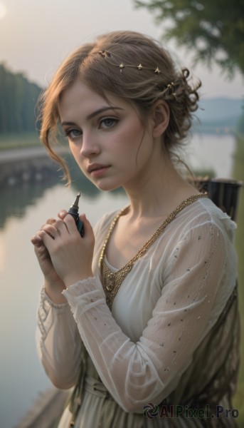 1girl,solo,looking at viewer,short hair,blue eyes,brown hair,hair ornament,long sleeves,dress,holding,jewelry,upper body,outdoors,parted lips,day,necklace,white dress,blurry,lips,grey eyes,depth of field,blurry background,freckles,realistic,blonde hair,see-through,own hands together