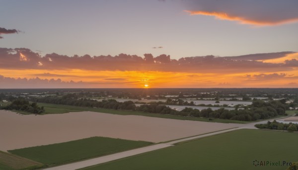 A breathtaking sunset outdoors featuring a landscape